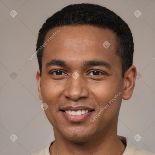 Joyful black young-adult male with short  black hair and brown eyes