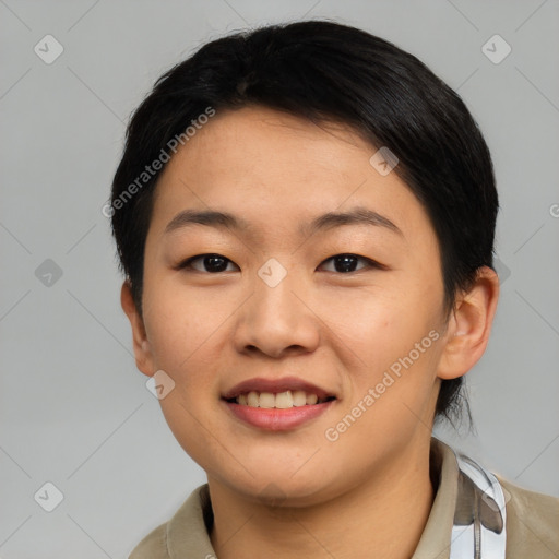 Joyful asian young-adult female with short  black hair and brown eyes