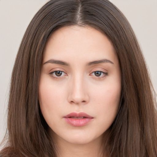 Neutral white young-adult female with long  brown hair and brown eyes