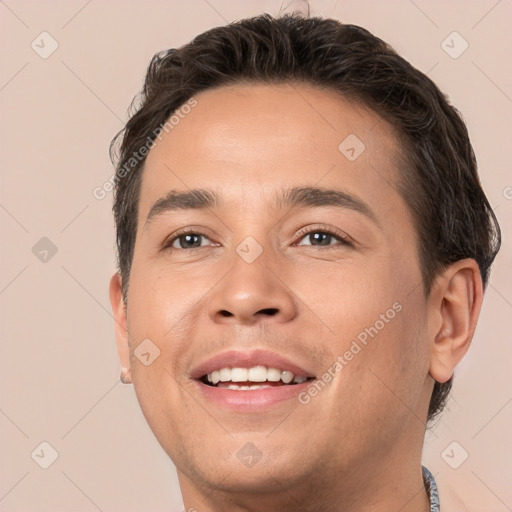 Joyful white young-adult male with short  brown hair and brown eyes