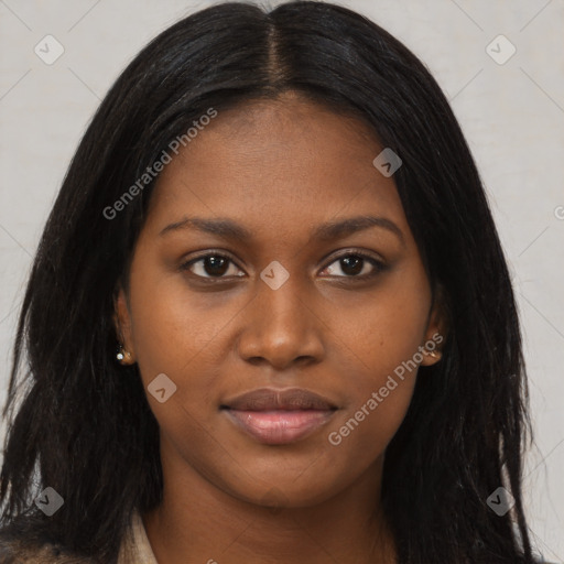 Joyful black young-adult female with long  black hair and brown eyes