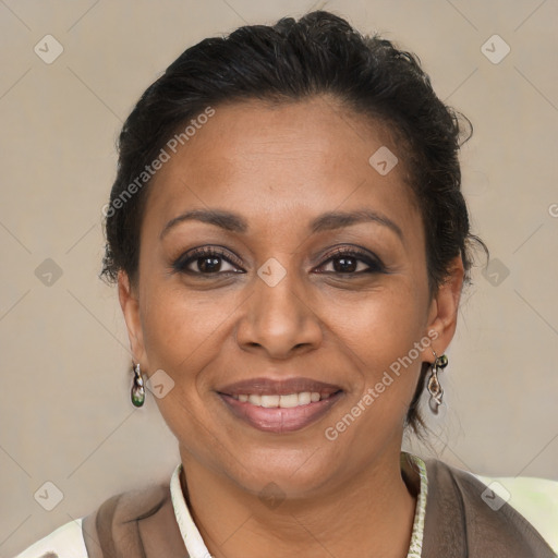 Joyful latino adult female with short  brown hair and brown eyes