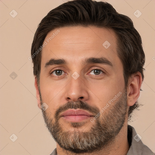 Joyful white adult male with short  brown hair and brown eyes