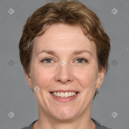 Joyful white adult female with short  brown hair and grey eyes