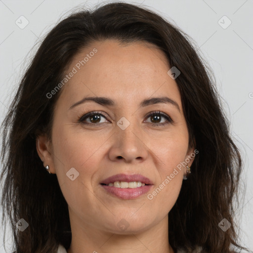 Joyful white adult female with long  brown hair and brown eyes