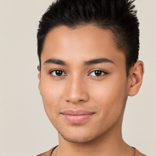 Joyful latino young-adult male with short  brown hair and brown eyes