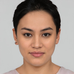 Joyful asian young-adult female with short  black hair and brown eyes