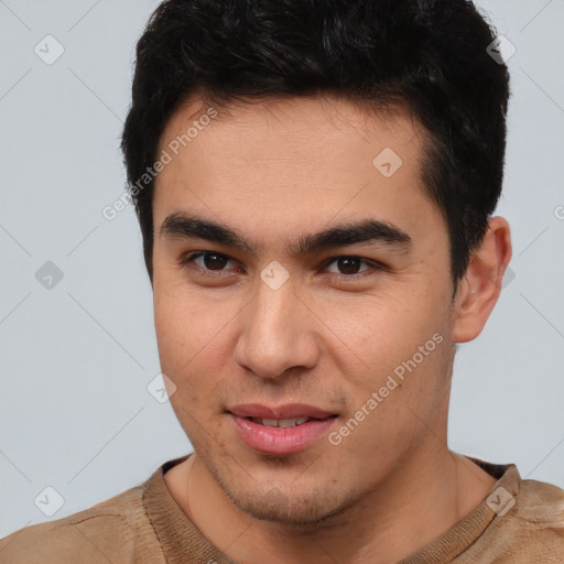 Joyful latino young-adult male with short  brown hair and brown eyes