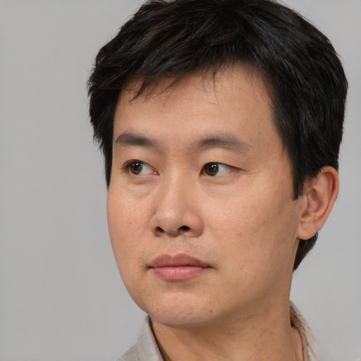Neutral asian young-adult male with short  black hair and brown eyes