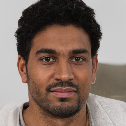 Neutral black young-adult male with short  brown hair and brown eyes