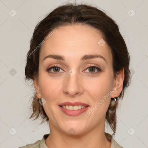 Joyful white young-adult female with medium  brown hair and green eyes