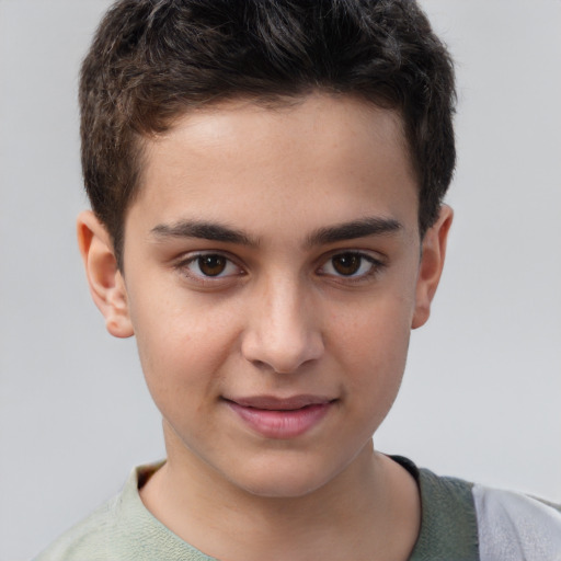 Joyful white child male with short  brown hair and brown eyes