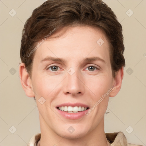 Joyful white young-adult female with short  brown hair and grey eyes