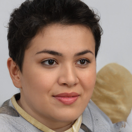 Joyful latino young-adult female with short  brown hair and brown eyes