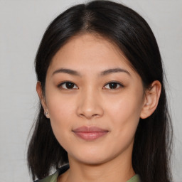 Joyful asian young-adult female with long  brown hair and brown eyes