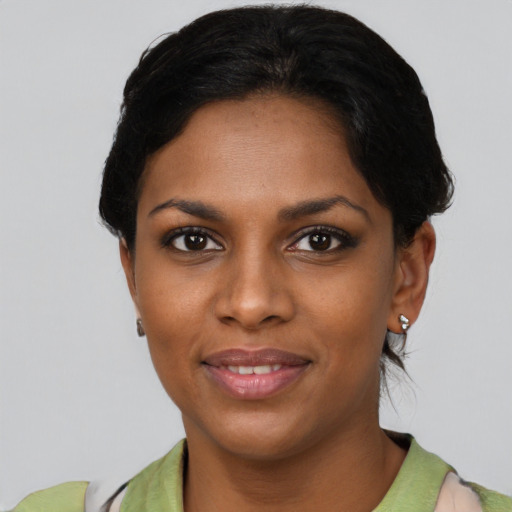 Joyful asian young-adult female with short  black hair and brown eyes