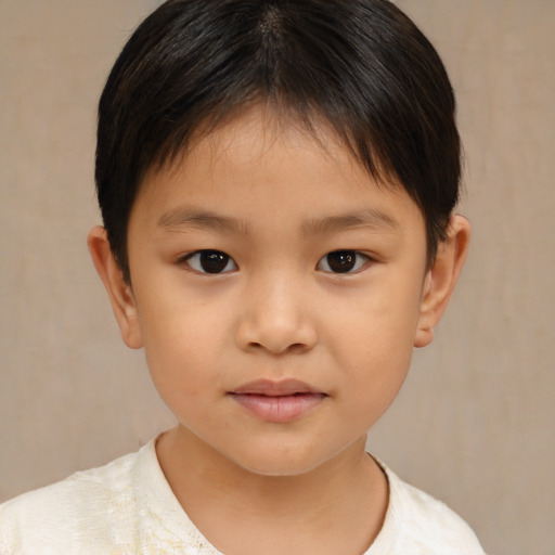 Joyful white child female with short  brown hair and brown eyes
