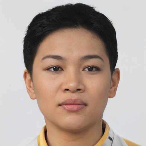 Joyful latino young-adult female with short  black hair and brown eyes