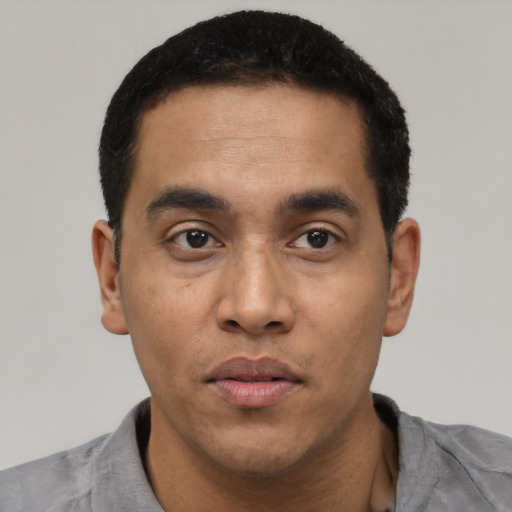 Neutral latino young-adult male with short  black hair and brown eyes