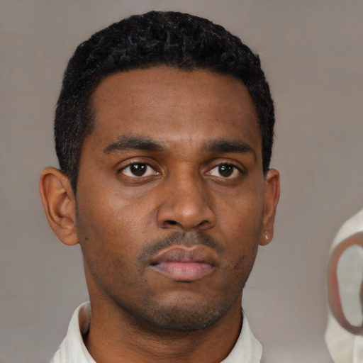 Neutral black young-adult male with short  black hair and brown eyes