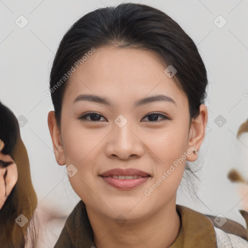 Joyful asian young-adult female with medium  brown hair and brown eyes