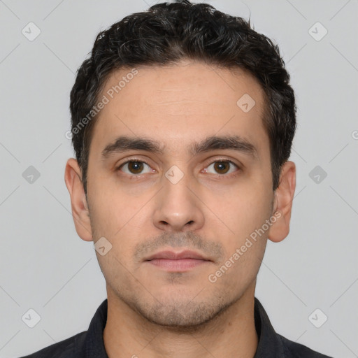 Neutral white young-adult male with short  black hair and brown eyes