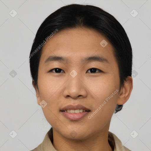 Joyful asian young-adult male with short  black hair and brown eyes