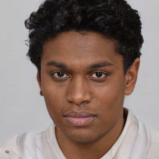 Neutral black young-adult male with short  black hair and brown eyes