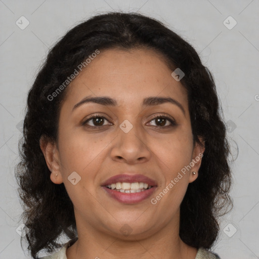 Joyful latino adult female with medium  brown hair and brown eyes