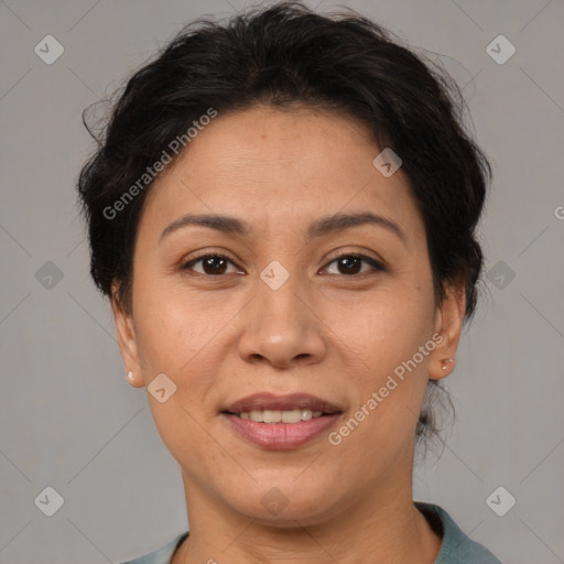 Joyful latino adult female with short  brown hair and brown eyes