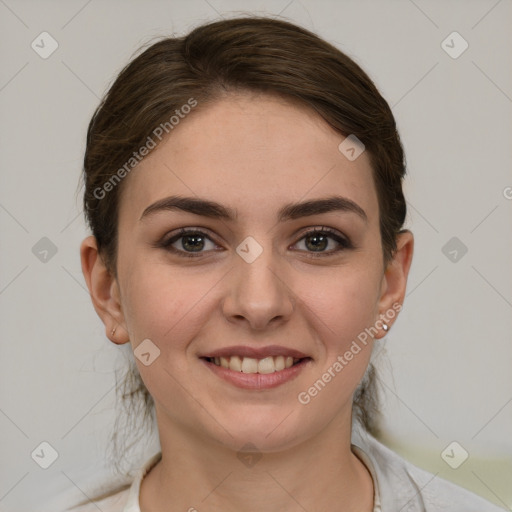 Joyful white young-adult female with medium  brown hair and grey eyes