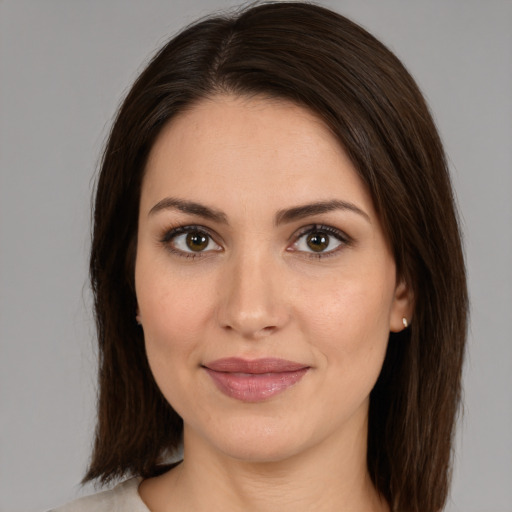 Joyful white young-adult female with medium  brown hair and brown eyes