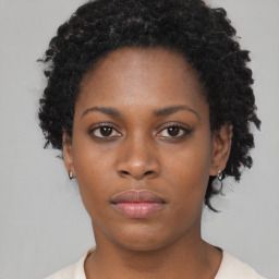 Neutral black young-adult female with short  black hair and brown eyes