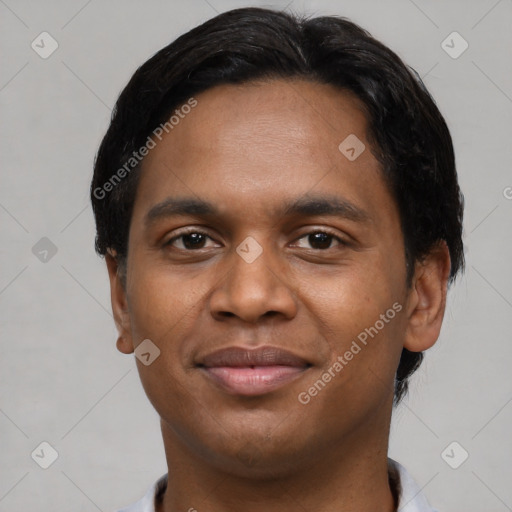 Joyful black young-adult male with short  black hair and brown eyes