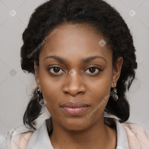 Joyful black young-adult female with long  black hair and brown eyes