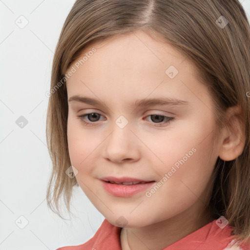 Joyful white child female with medium  brown hair and brown eyes