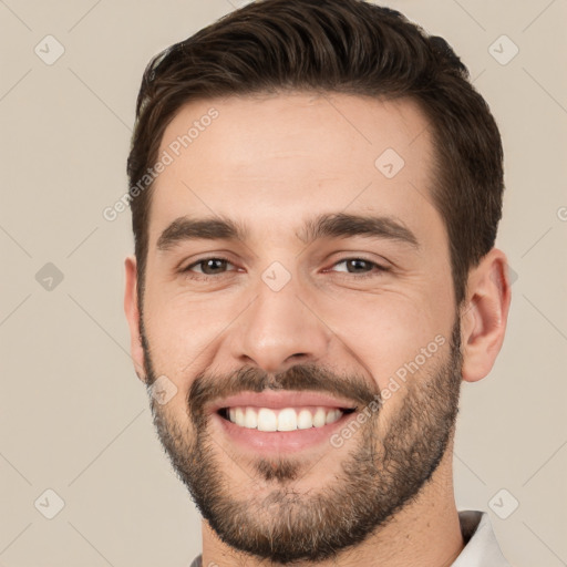 Joyful white young-adult male with short  brown hair and brown eyes