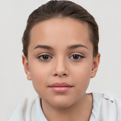 Joyful white child female with short  brown hair and brown eyes