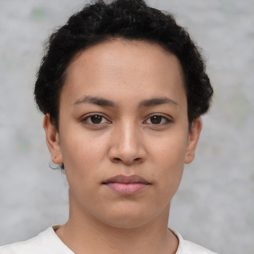 Neutral white young-adult female with short  brown hair and brown eyes