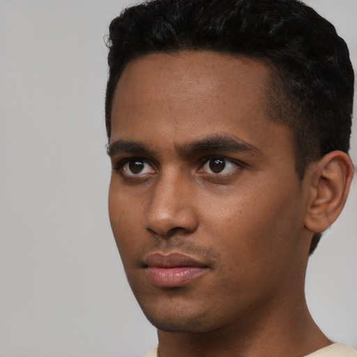 Neutral black young-adult male with short  black hair and brown eyes