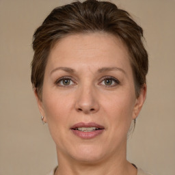 Joyful white adult female with short  brown hair and brown eyes