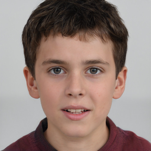 Joyful white child male with short  brown hair and brown eyes