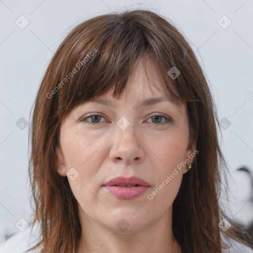 Joyful white adult female with long  brown hair and grey eyes