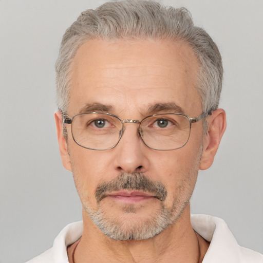 Neutral white middle-aged male with short  gray hair and brown eyes