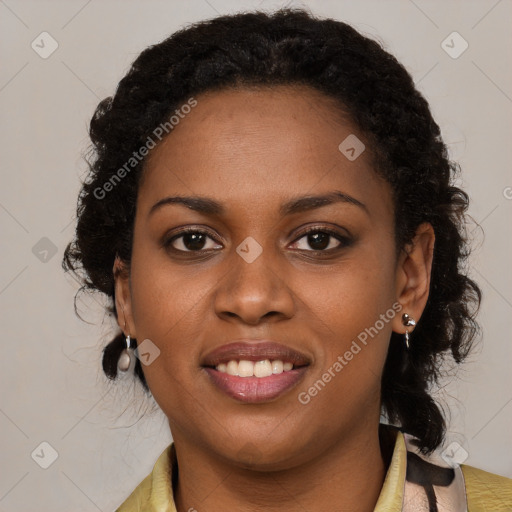 Joyful black young-adult female with long  brown hair and brown eyes