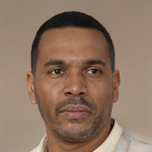 Neutral latino adult male with short  brown hair and brown eyes