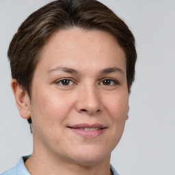 Joyful white adult female with short  brown hair and brown eyes