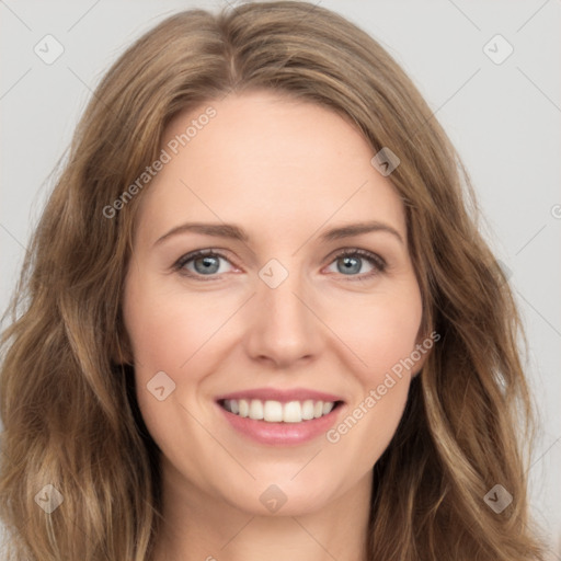 Joyful white young-adult female with long  brown hair and green eyes