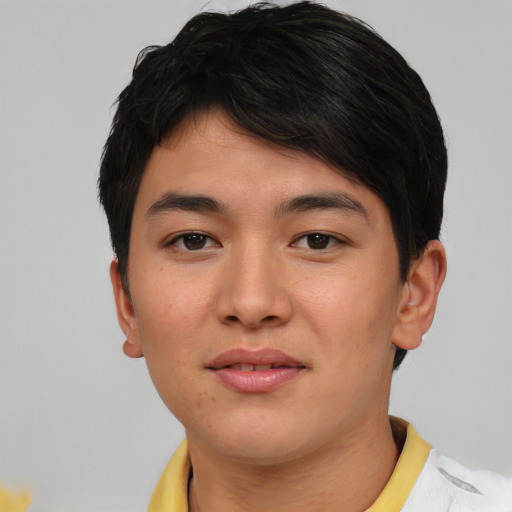 Joyful asian young-adult male with short  brown hair and brown eyes