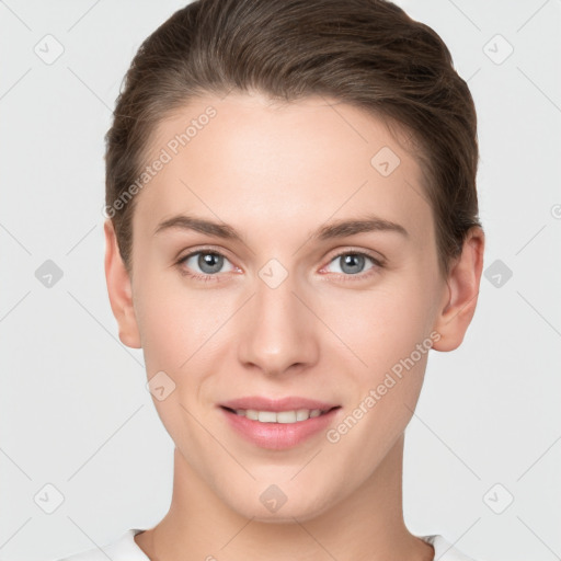 Joyful white young-adult female with short  brown hair and grey eyes